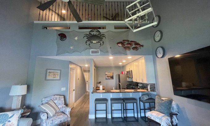 Thomas Drive Condo | Beautiful Lagoon-View Condo – 1BR + Loft in Gated Community, 5-Min Walk to Beach