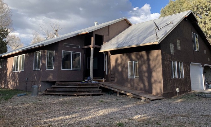 Questa House | Big family home on the river