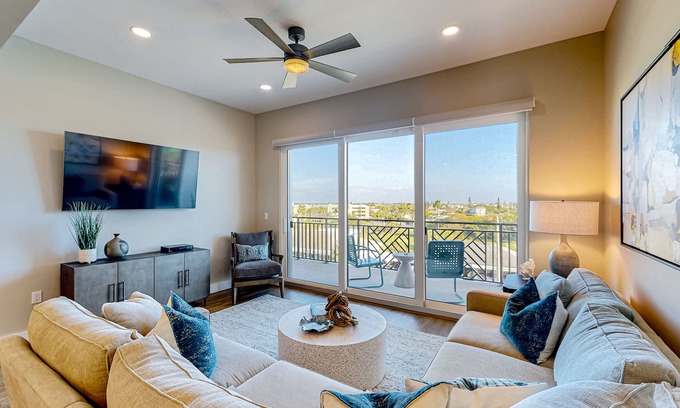 Madeira Beach Condo | Brand-new condo steps to beach with balcony, pool, & hot tub - dog-friendly
