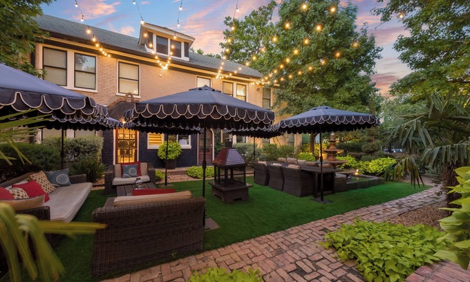 Old East Dallas Condo | Bright and luxurious 1-bedroom condo combining historic charm with modern comfort. Features a spacious living area with elegant furnishings, crystal lighting, and abundant natural light for a refined Dallas stay.