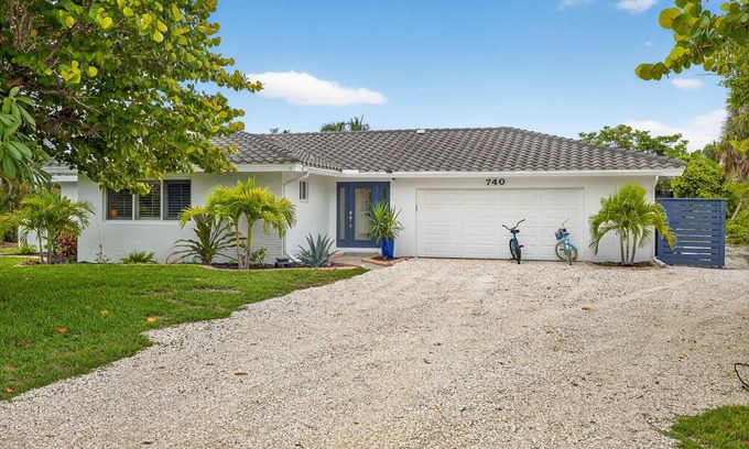 Sanibel House | Canal front ground level beauty steps to the beach