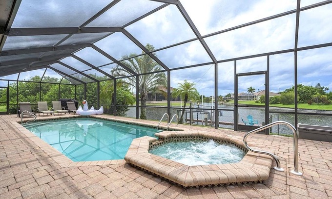 Cape Coral House | Canalfront/Outdoor Kitchen/Pool/Spa/Boat Dock