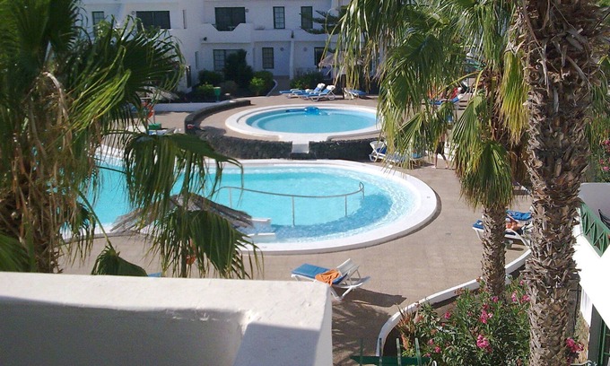 Puerto del Carmen Apartment | Casa Kazz, lovely 1 bed central PDC apartment with sea & pool views