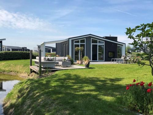 Wemeldinge House | Chalet in Zeeland with Garden and Fireplace