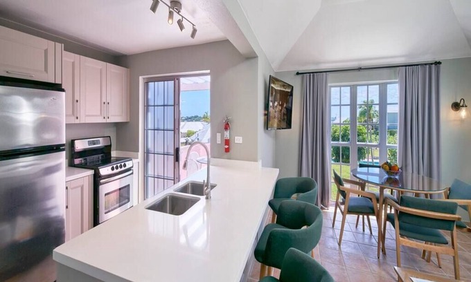 St. George's Cottage | Charming 2BR Cottage with Poolside View