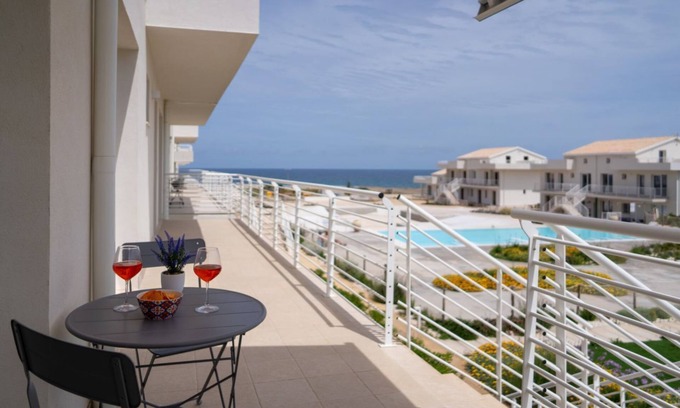 Pachino Apartment | Charming 40 sqm apartment with sea view, accommodating up to 4 guests, located within the renowned Borgo 84 residence, which features a swimming pool and a cycling path. The property is just 3 km from the center of Marzamemi, one of the most picturesque