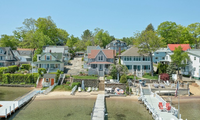 Weirs Beach House | Charming Lakefront Cottage Nearby to the Weirs with dock and sand beach