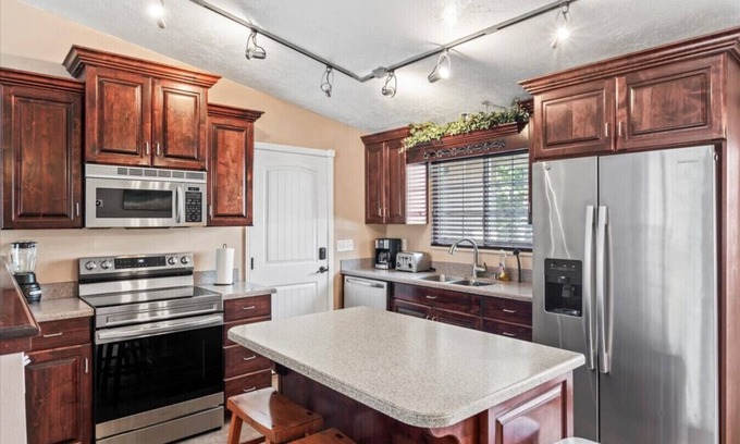 Millcreek House | Charming Mountain Retreat with Enclosed Backyard and Artistic Flair