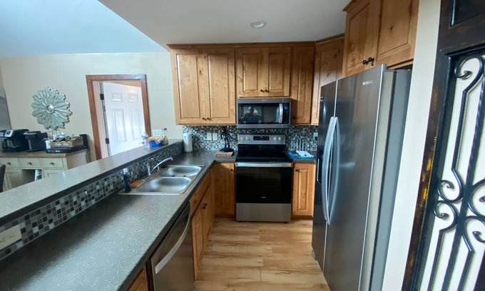 Arnolds Park House | Charming upscale vacation cottage on the pond in the Bridges Bay Resort property