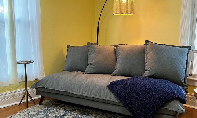 Ypsilanti Apartment | Cheerful 2BR apt, historic home near EMU and U-M, walkable area. Dog friendly!