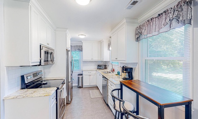 Blair Heights House | Cheerful dog-friendly home with a large yard, central AC, patio, & washer/dryer