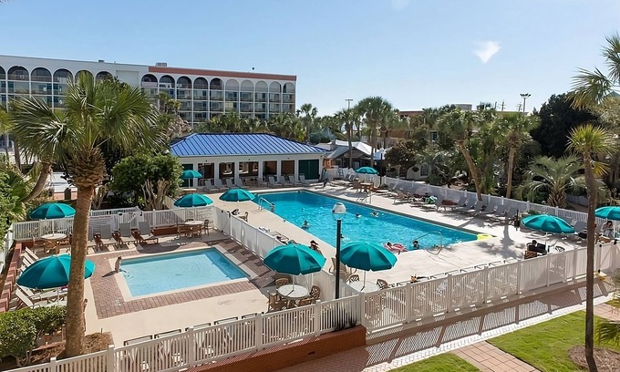 Fort Walton Beach Hotel | Coastal Escape with Heated Outdoor Pool Near Boardwalk on Okaloosa Island
