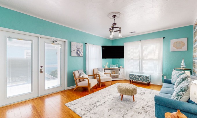 East Daytona House | Colorful charmer with ocean views, deck, & dog-friendly yard - snowbird-friendly