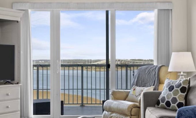 Morehead City Condo | Come watch the Dolphin play! Pool, Jacuzzi, & Gym Walking distance to the Beach!