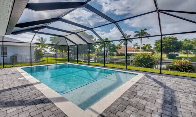 Pelican House | Cozy in the Cape, Heated Saltwater Pool & Gulf access, water view