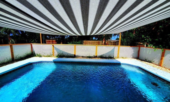 Inverness House | Cozy Oasis nestled on 2 acres w pool and lake views