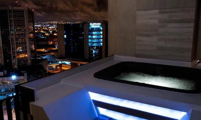Zona 4 Condo | Cozy penthouse with a hot tub and an amazing view. 15 minutes from the airport.