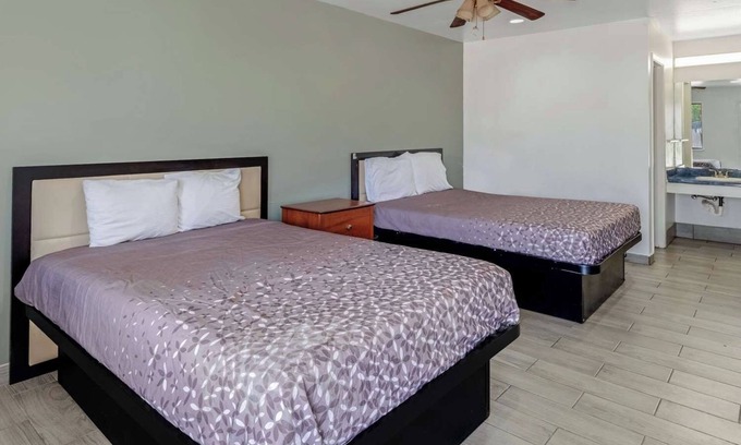 Eastside Promise Neighborhood Hotel | Cozy Room Offering Free Breakfast Near DT San Antonio - Ideal for Business Trips