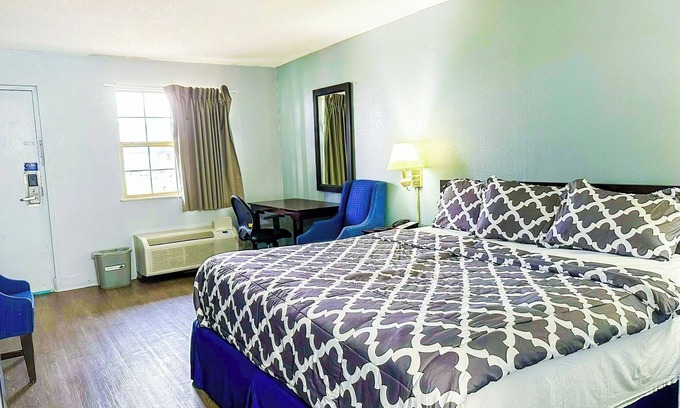 Madisonville Hotel | Cozy Room with King Bed and Microwave and Fridge for a Comfortable Stay