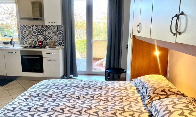 Isola Sacra Apartment | Cozy studio flat with patio, 5 minutes to Fiumicino airport.
