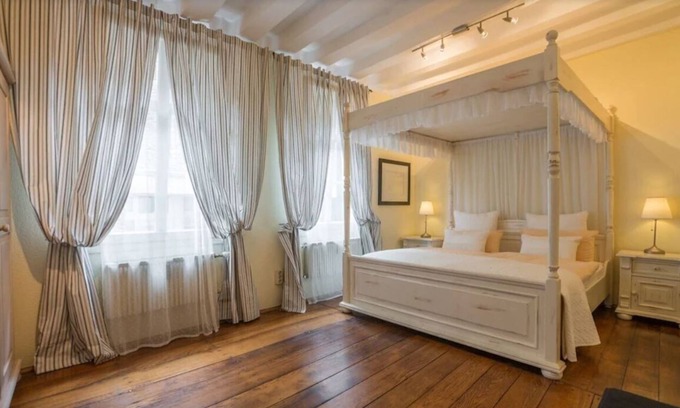 Monschau Apartment | Design apartment 1 with four-poster bed, WLAN, SAT, ground floor.