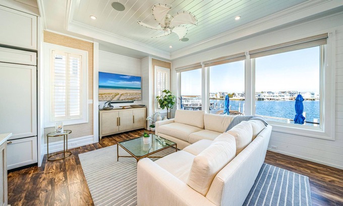 Stone Harbor House | Discover the epitome of coastal living in this exceptional bayfront residence, a true gem boasting.
