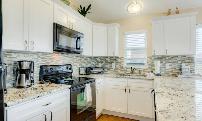 Terramar Beach House | Dog-friendly home with pool access, large deck, lawn games, washer/dryer & AC