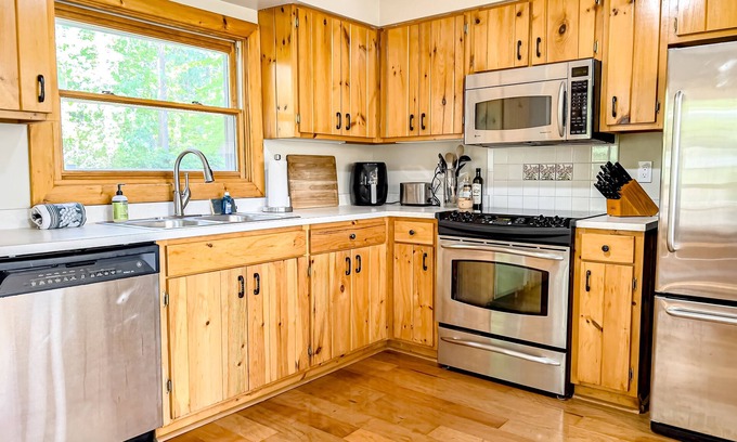 Minocqua House | Dog-friendly lakeside charmer with deck, dock access, & wood-burning fireplace