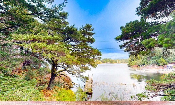 Port Orford House | Dog-friendly lakefront home with lake views, deck, partial AC, & W/D