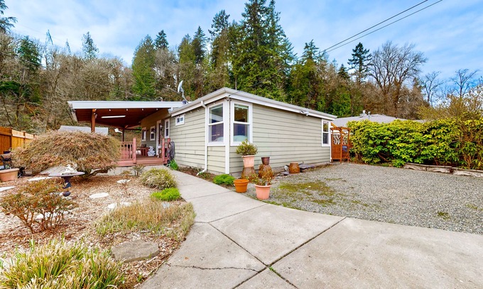 Maplewood House | Dog-friendly riverfront home with patio, golf nearby, enclosed yard, & W/D