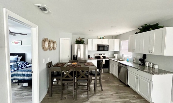 Mid Island Condo | 🐾 Dog Friendly, Spacious Beach Retreat, only Steps to Sugary Sand, Conveniences and all the Fun!