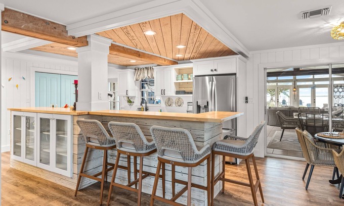 Bay Point House | Dog-friendly waterfront home with outdoor kitchen, bar, firepit, & kayak launch