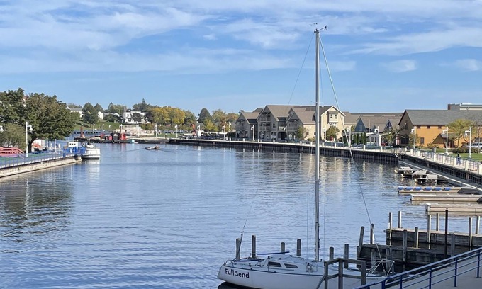 Sheboygan Condo | Downtown waterfront condo. Full hook-up boat slip! Close to beach! Private deck!