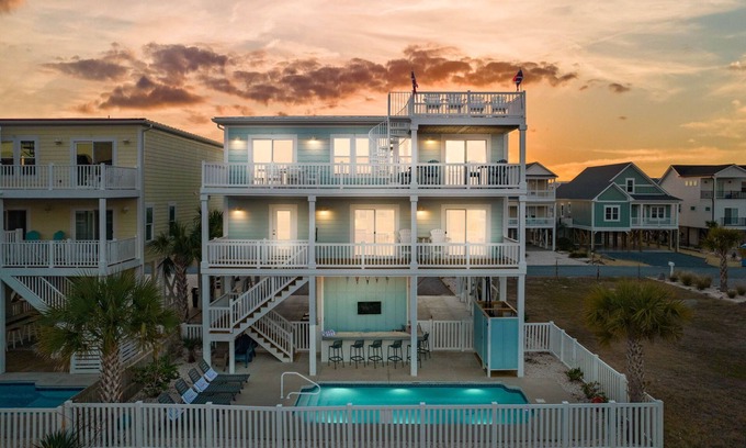 Sunset Beach House | Easy Breezy is a stunning 4 bedroom, 4 bathroom house with a private pool and elevator