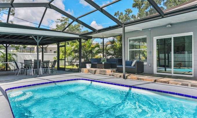 Tampa House | Elegant 4BR Family Retreat with Heated Pool This beautifully appointed home offers 4 spacious bedrooms, 2 modern bathrooms, AC, private pool and sleeps up to 10 guests in total comfort.