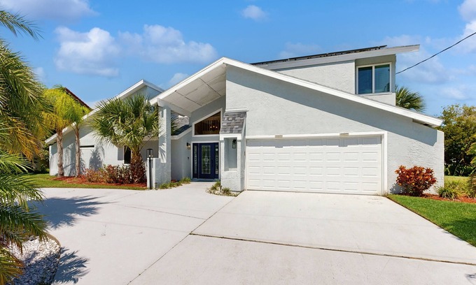 Palm Harbor House | Elegant sound view home with enclosed pool, dock, pool table, fireplace, & grill