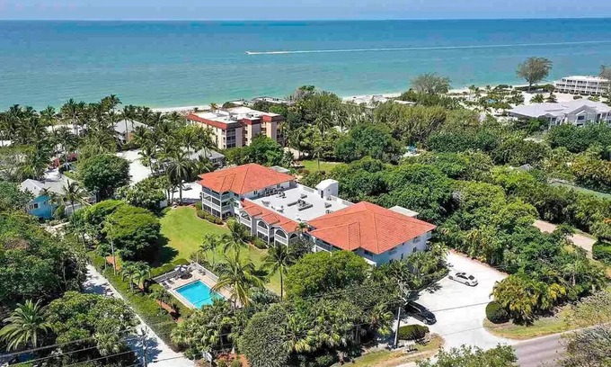 Sanibel Condo | End unit with extra windows. Steps to the beach, private beach access!