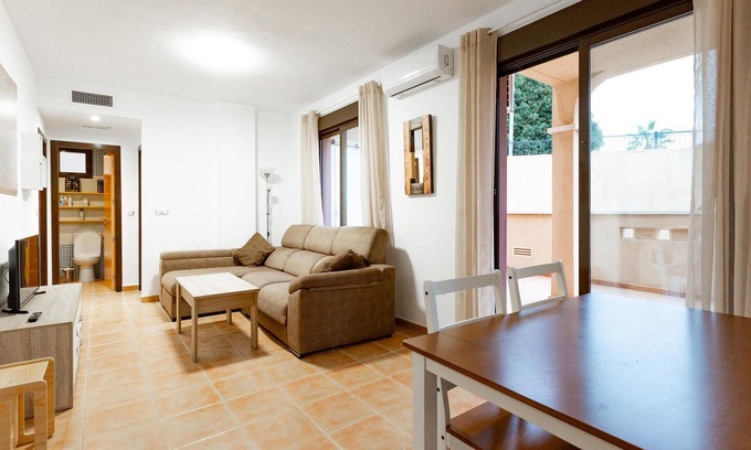 Los Geraeos Apartment | Enjoy a relaxing vacation in this terraced house with communal pool.