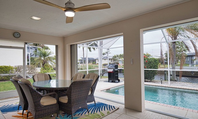 Punta Gorda House | Enjoy a tranquil vacation on expansive canal with passing boats and heated pool.