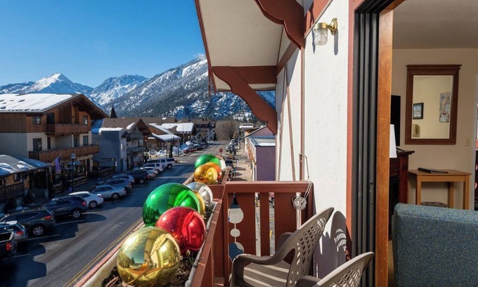 Leavenworth Hotel | Enjoy easy walking access to all Leavenworth has to offer after a relaxing night in our King room with a cozy fireplace and Juliette balcony.