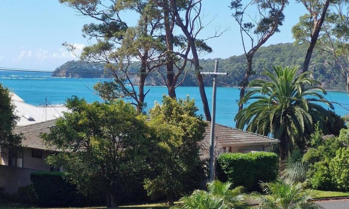 South Coast House | Entire Home, Denham's Beach NSW 2536. View of the water & 2 mins to the beach.
