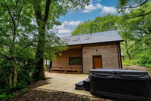 Farley House | Errwood, woodland lodge with hot tubs for 14