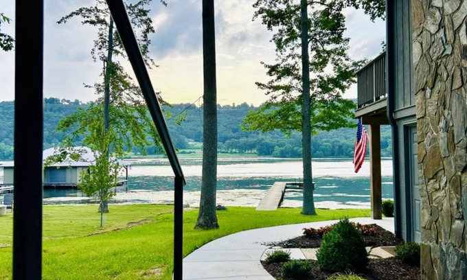 Grant House | Escape to our beautifully updated lakeside retreat, where every detail is designed for comfort and relaxation. From the moment you step inside this 3 bed/2bath house, you'll be captivated by sweeping, unobstructed views of the lake through expansive
