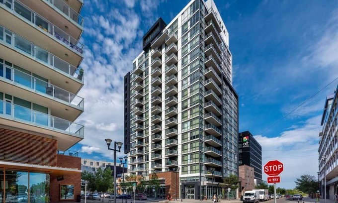 East Village Apartment | Executive 1-Bed + Office Loft – Prime Riverfront, Gym, Near Stampede & City Life
