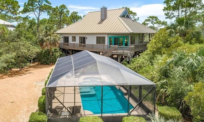 Plantation House | FALL SAVINGS! Canal Front, small dog ok, dock, screened private pool!