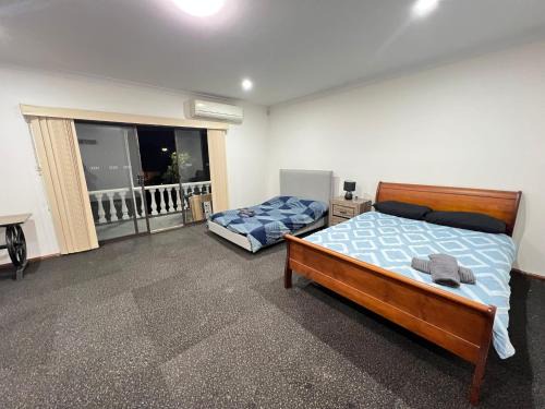 Lurnea House | Family Room with Attached Private Balcony - L4