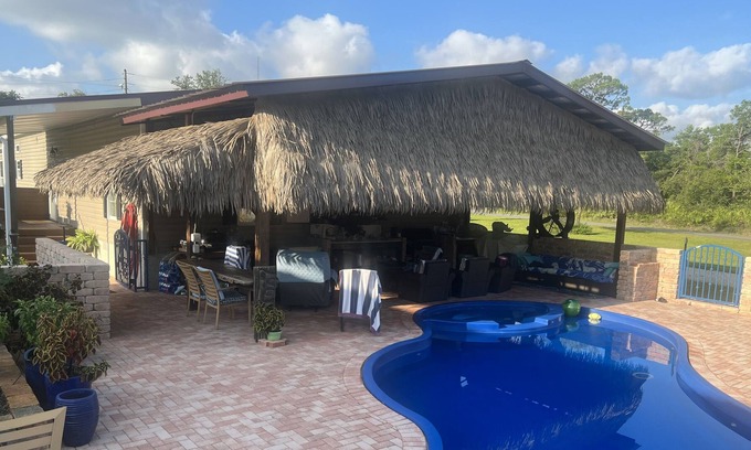 Magnolia Bluffs House | Family secure home with your own Tiki Hut close to Beach SGI. Clean and modern.
