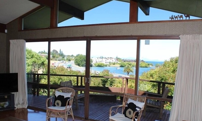 Waipahihi House | Fantastic holiday home with lake and mountain views