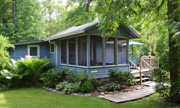 Baileys Harbor Cottage | Get away at this quaint cottage tucked behind a beautiful fern bed.