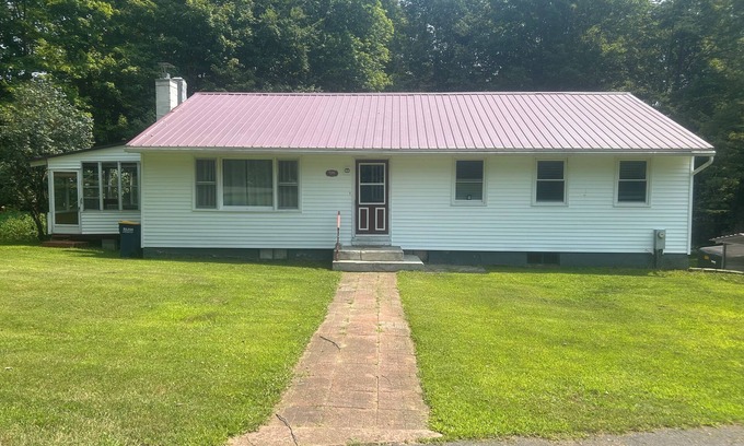 Taberg House | Glenmore Creek, ranch style home located on 10, mostly wooded, private acres.